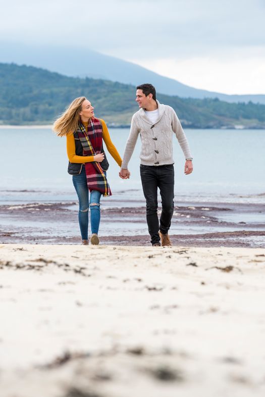 Couple on Tramore Beach things to do in waterford