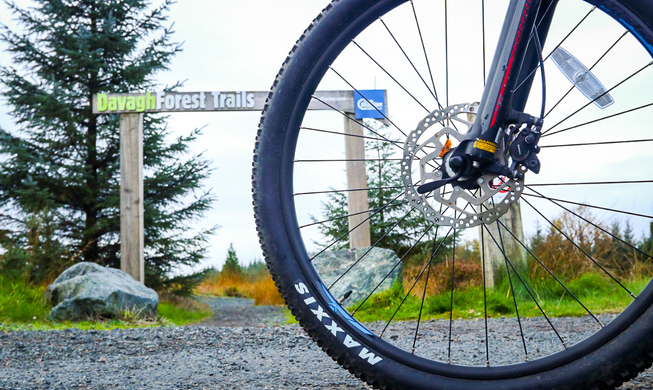 Wheel of the bike at the beginning of trail