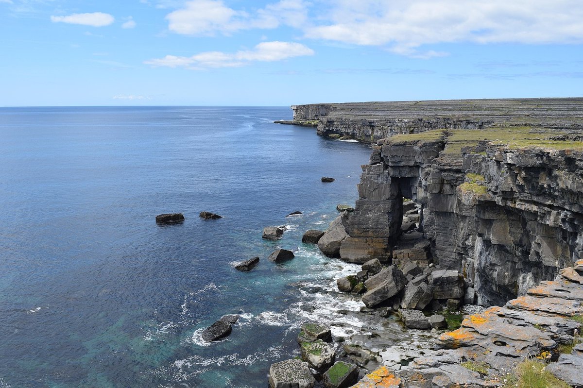 Stone walls and coastline on Inishmore, the largest of the Aran Islands, County Galway
