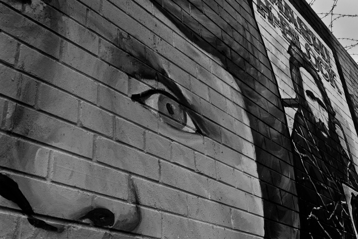 watchful eyes of a falls road mural, belfast's living history