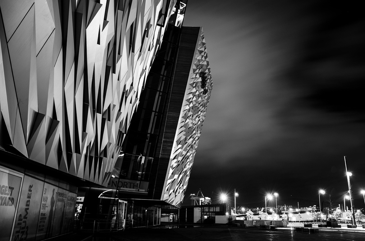 the razor-edged titanic belfast piercing a brooding night sky