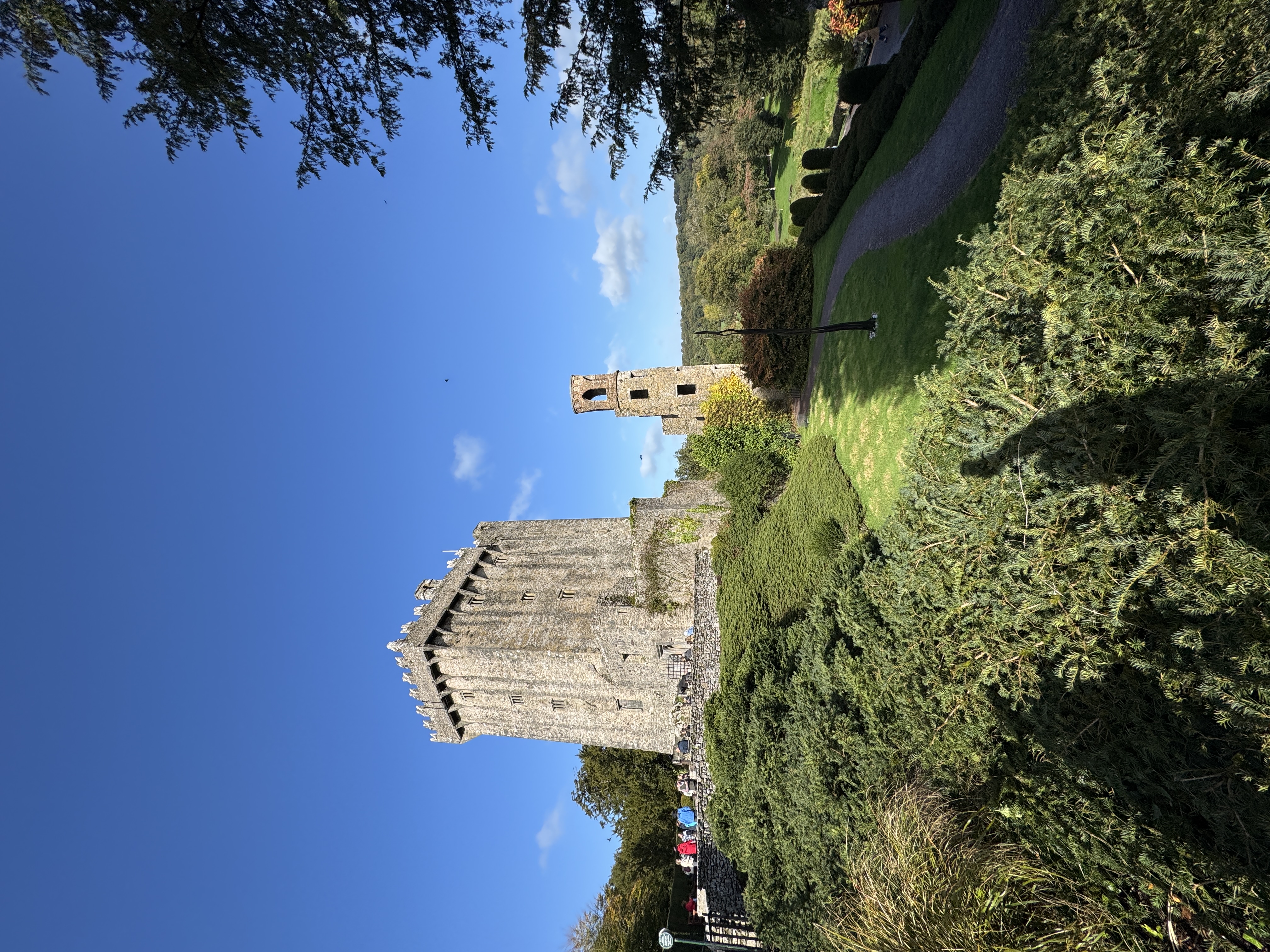 Blarney Castle and ruined tower on a sunny day, County Cork, Ireland