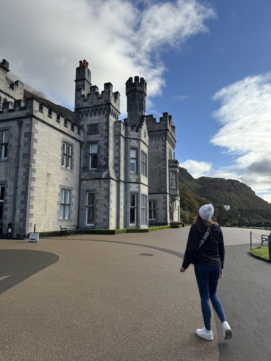 Dariece walking toward the entrance of Kylemore Abbey in Connemara, County Galway