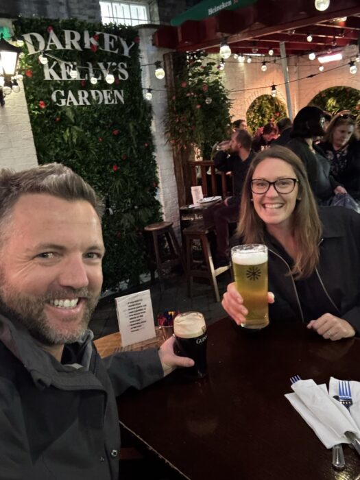 Couple enjoying drinks in the garden at Darkey Kelly's pub in Dublin city
