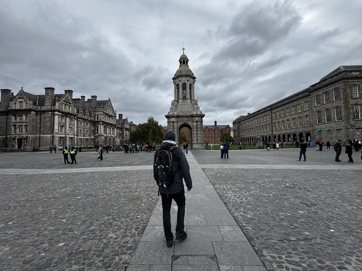 Nick walking toward the Campanile bell tower in Trinity College Dublin