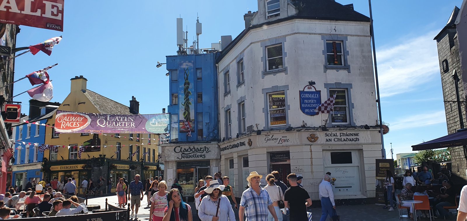 The busy Latin Quarter streets in Galway with banners and crowds