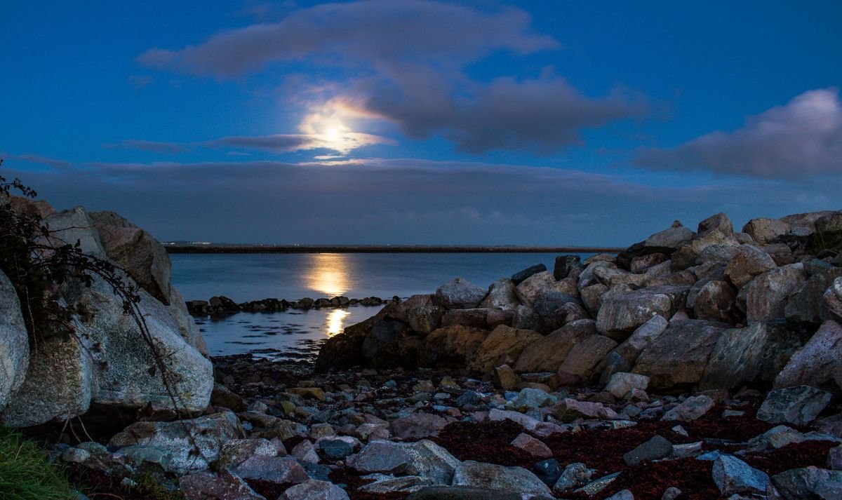 Galway Bay at dusk with the moon over the water