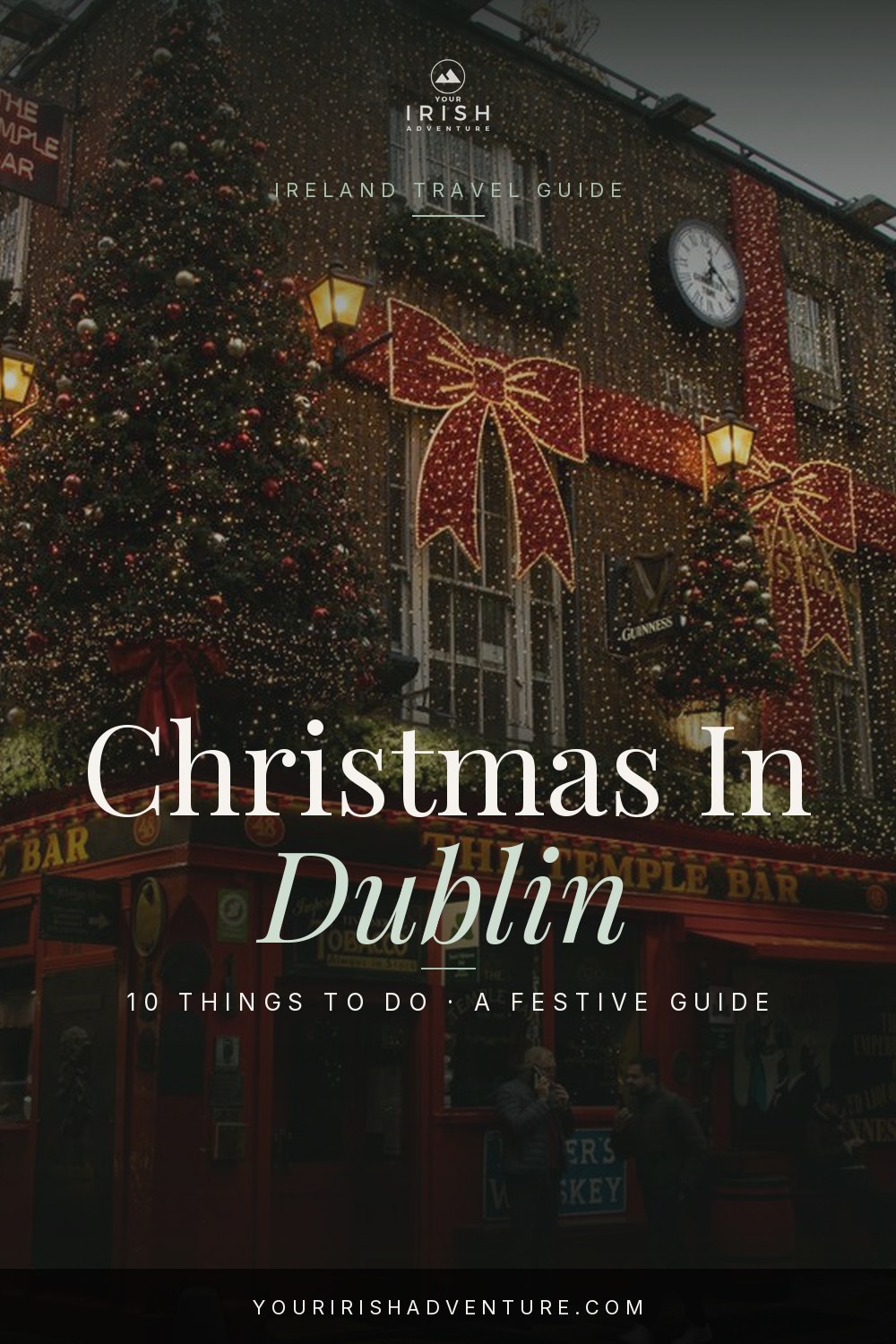 Christmas lights on Grafton Street in Dublin Ireland with festive decorations and shoppers