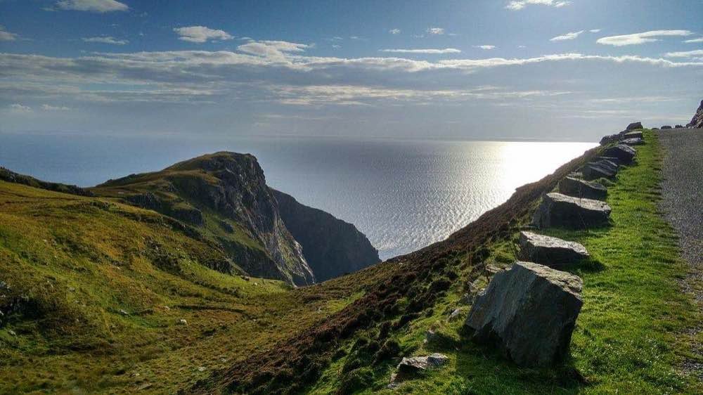 Sunlit sea below the Slieve League headland in Donegal