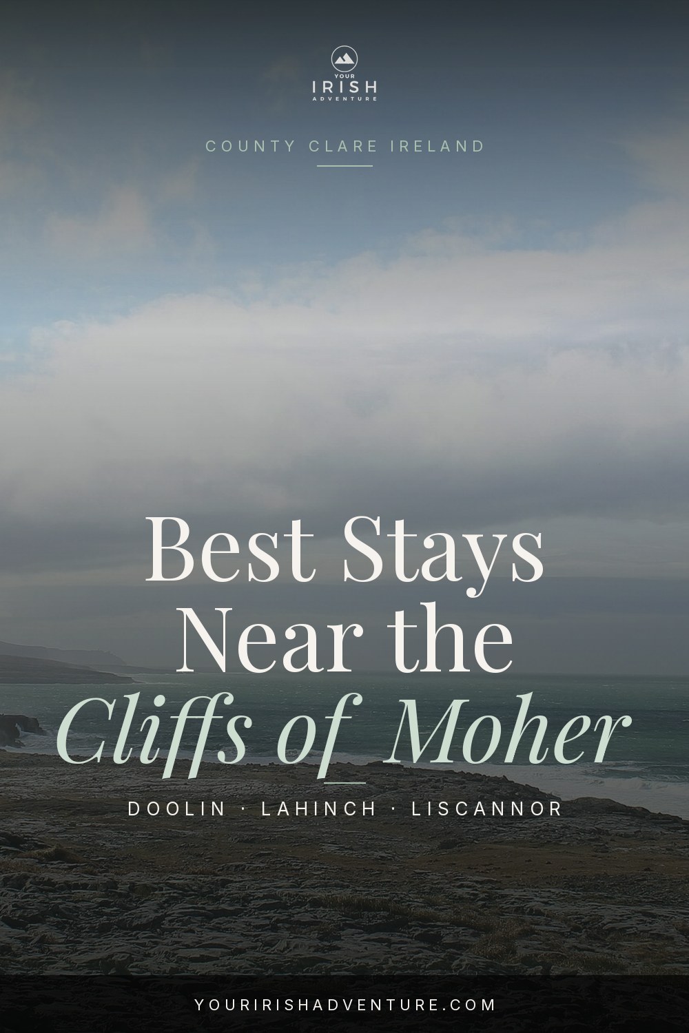 Stone cottage hotel with green fields and Atlantic Ocean view near the Cliffs of Moher in Ireland