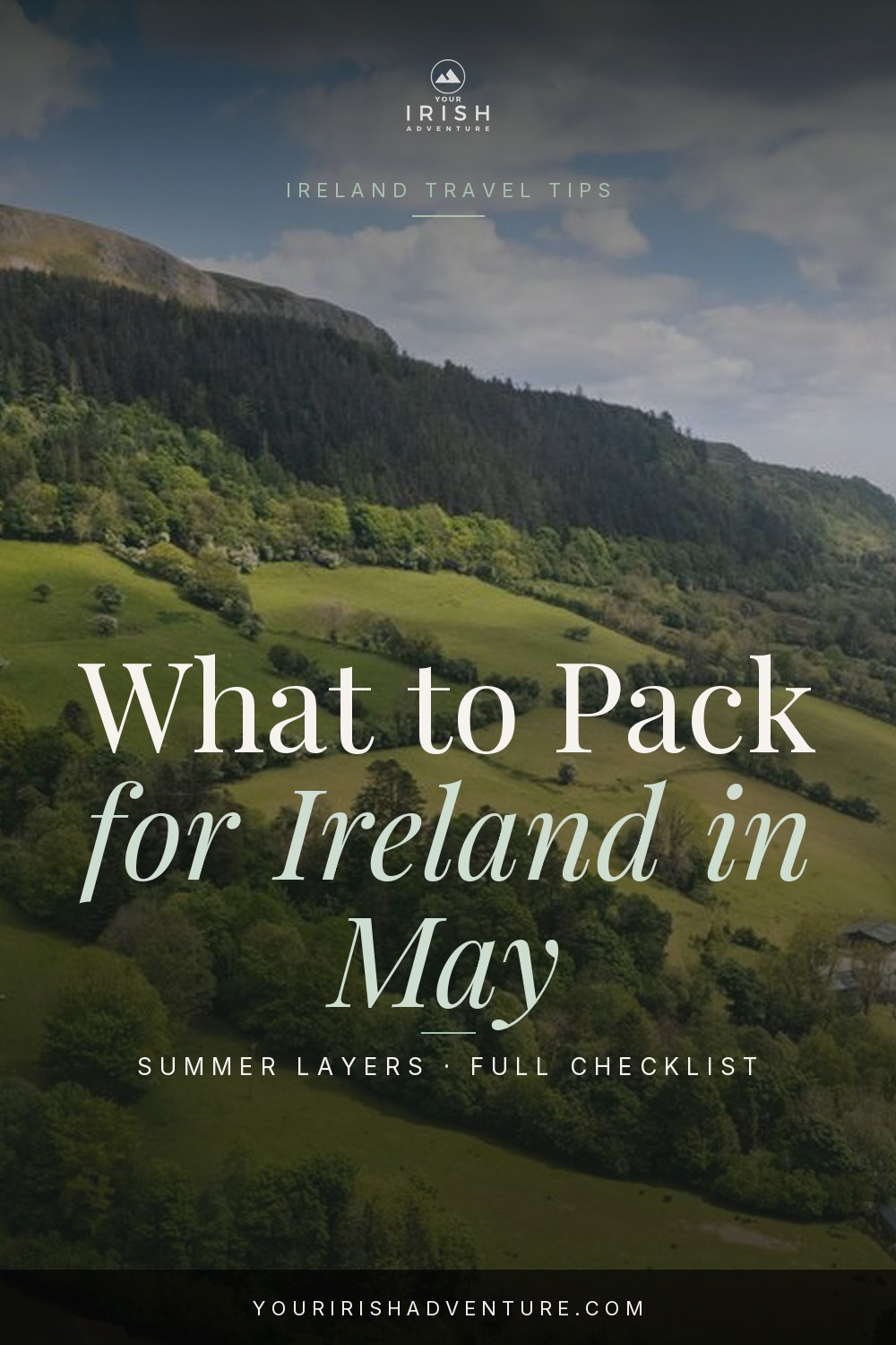 Ireland packing list for May with rain jacket, layers, and walking shoes laid out for a spring trip