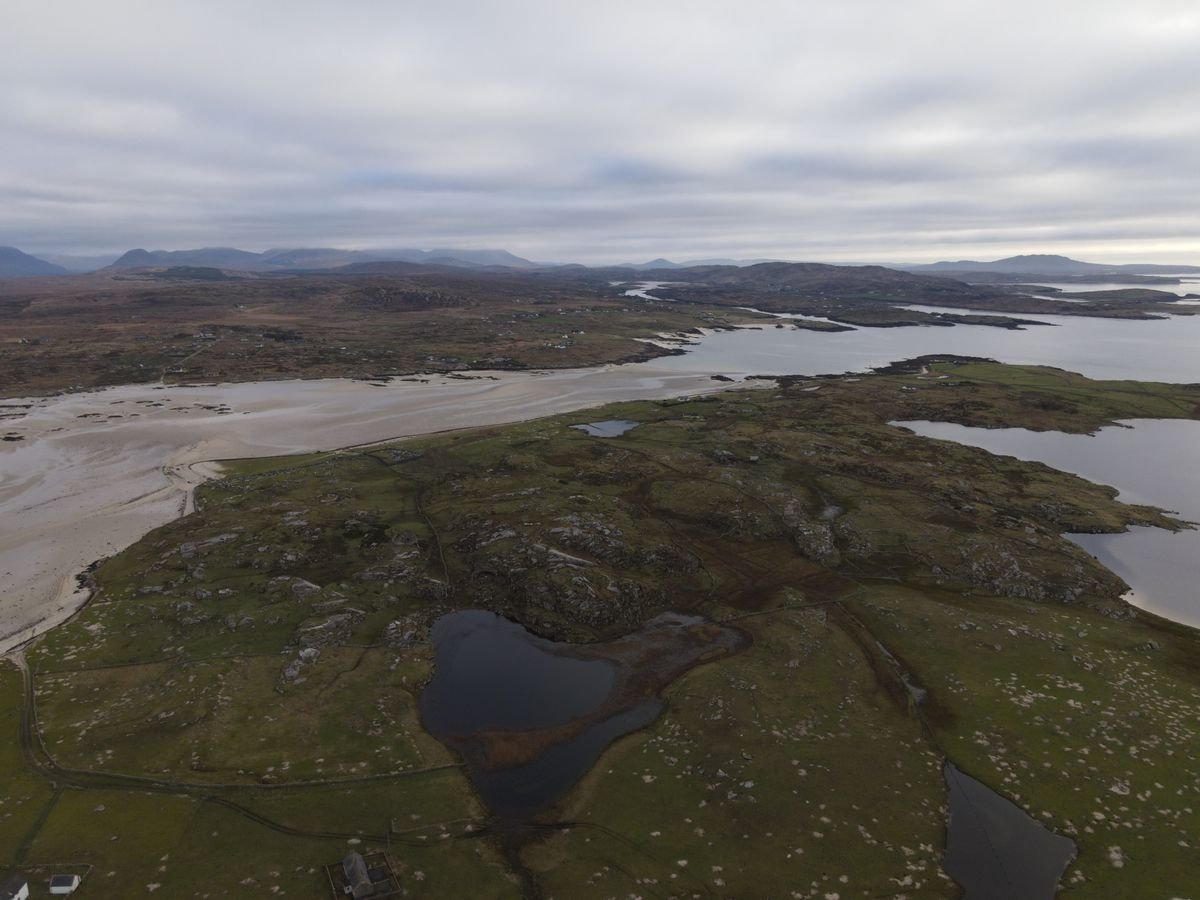 Green coastal landscape and islands in the west of Ireland