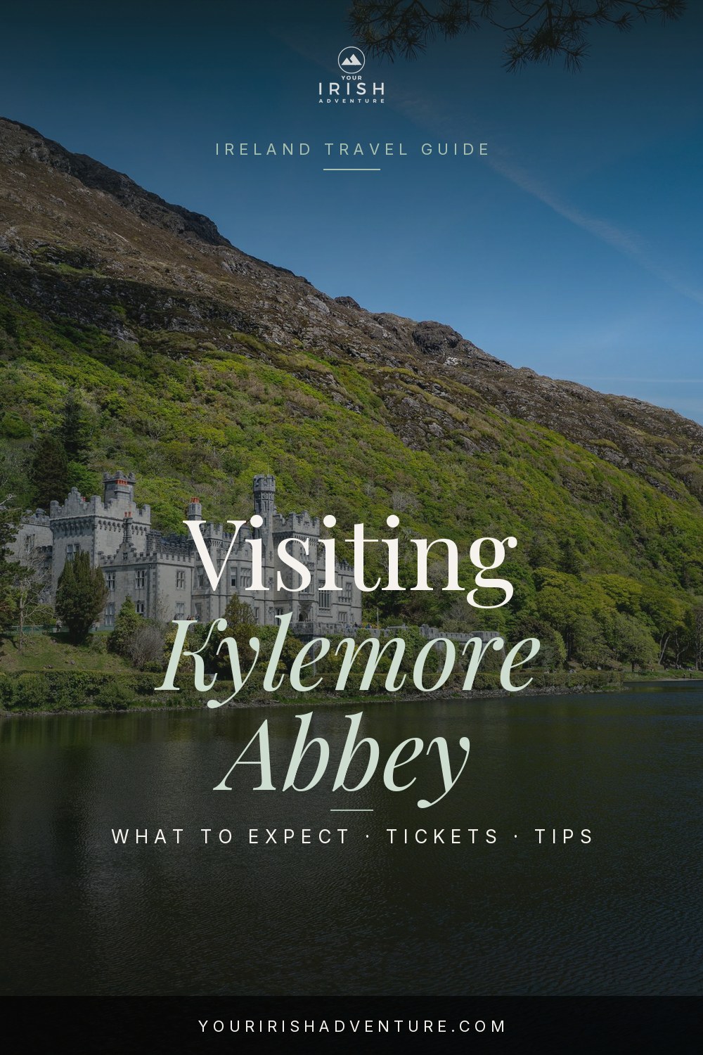 Kylemore Abbey reflected in the lake in Connemara, Ireland with mountains behind