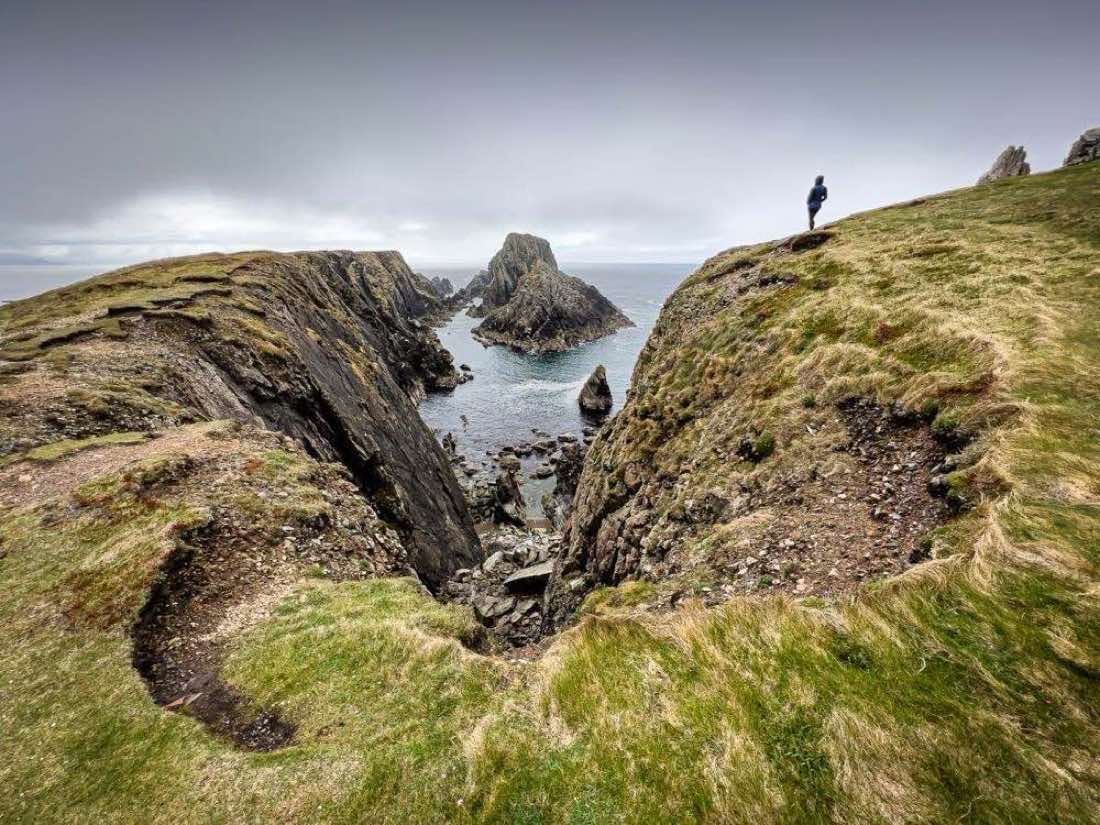 Rugged headland and sea stacks at Malin Head, the top of mainland Ireland