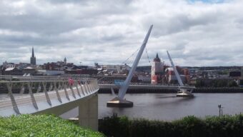 The Peace Bridge curving across the River Foyle in Derry