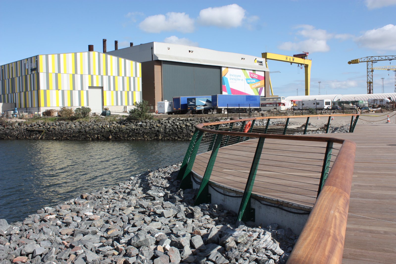 Waterfront walkway in the Titanic Quarter with a Harland and Wolff crane