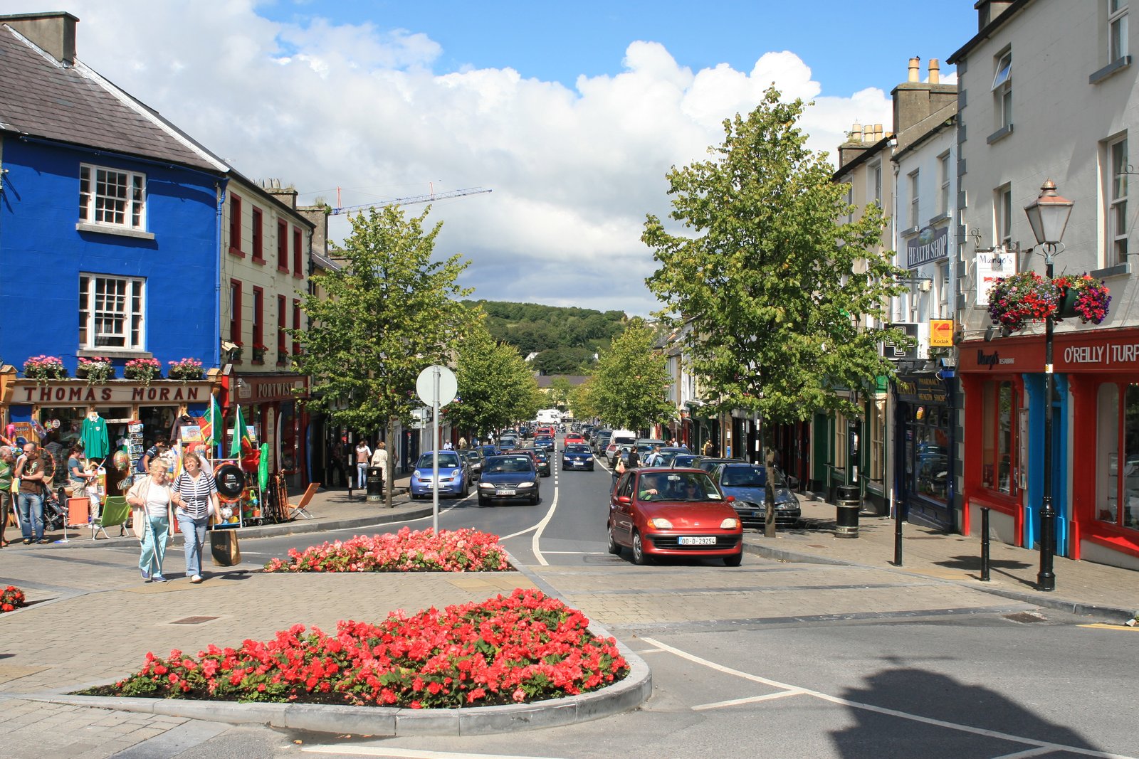 Colorful Georgian street with a stone clock tower in an Irish town
