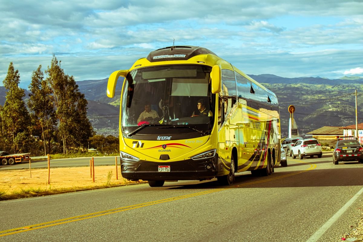 A coach on an open road, like the Doolin shuttle to the cliffs