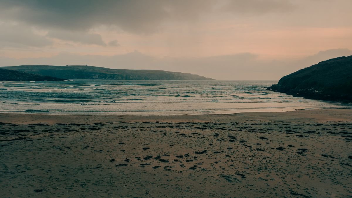 Sandy beach framed by headlands near Mizen Head in southwest Cork.