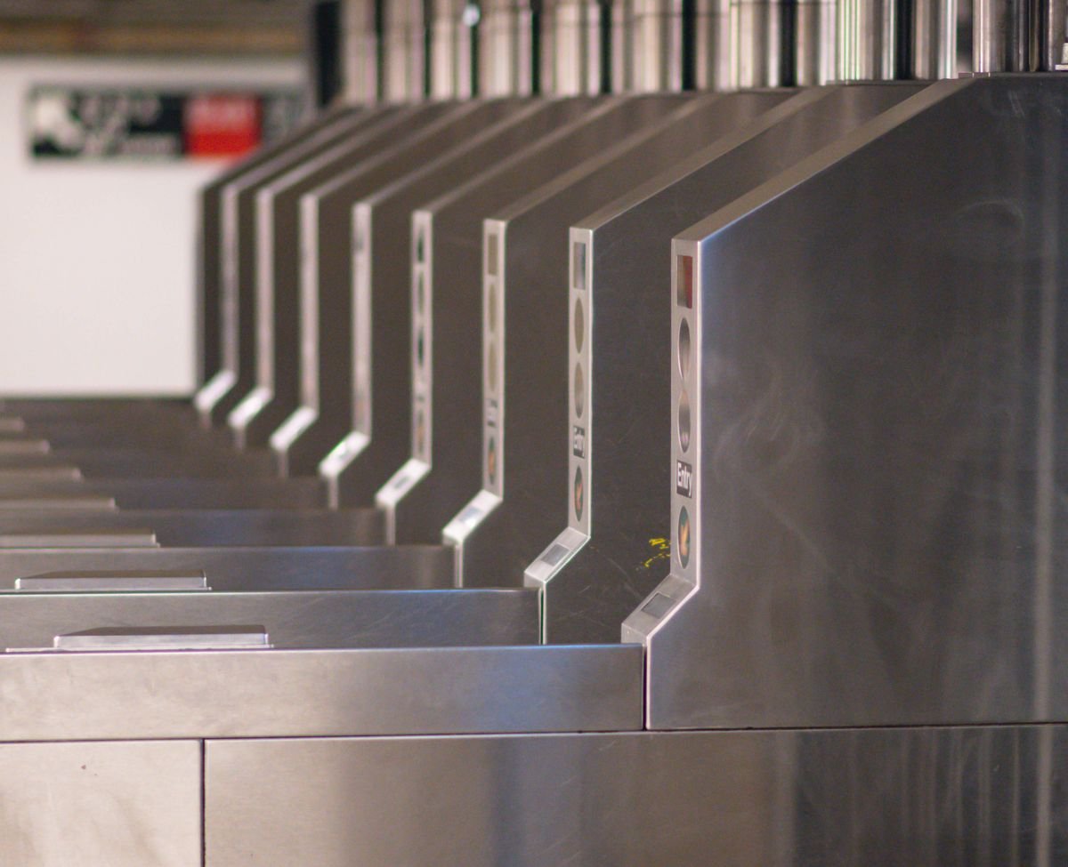 A row of turnstiles at the entrance to a stadium