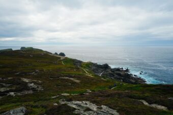 Narrow coastal path along an Irish clifftop above the Atlantic