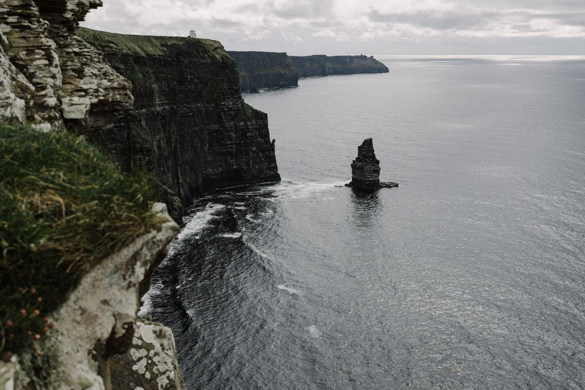 A sea stack rises off the southern cliffs, a marker you pass on the walk.