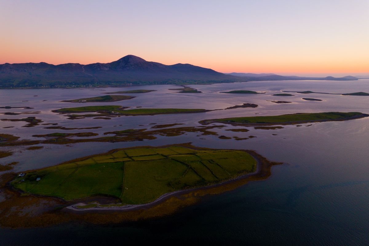 Aerial view of Clew Bay islands with Croagh Patrick at sunset