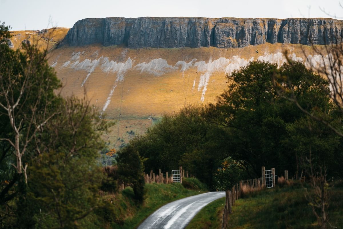 Benbulben mountain rising over a country road near Sligo