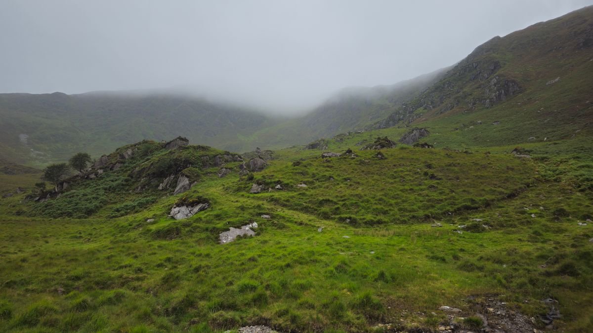 Misty green hills under low cloud in the Irish countryside