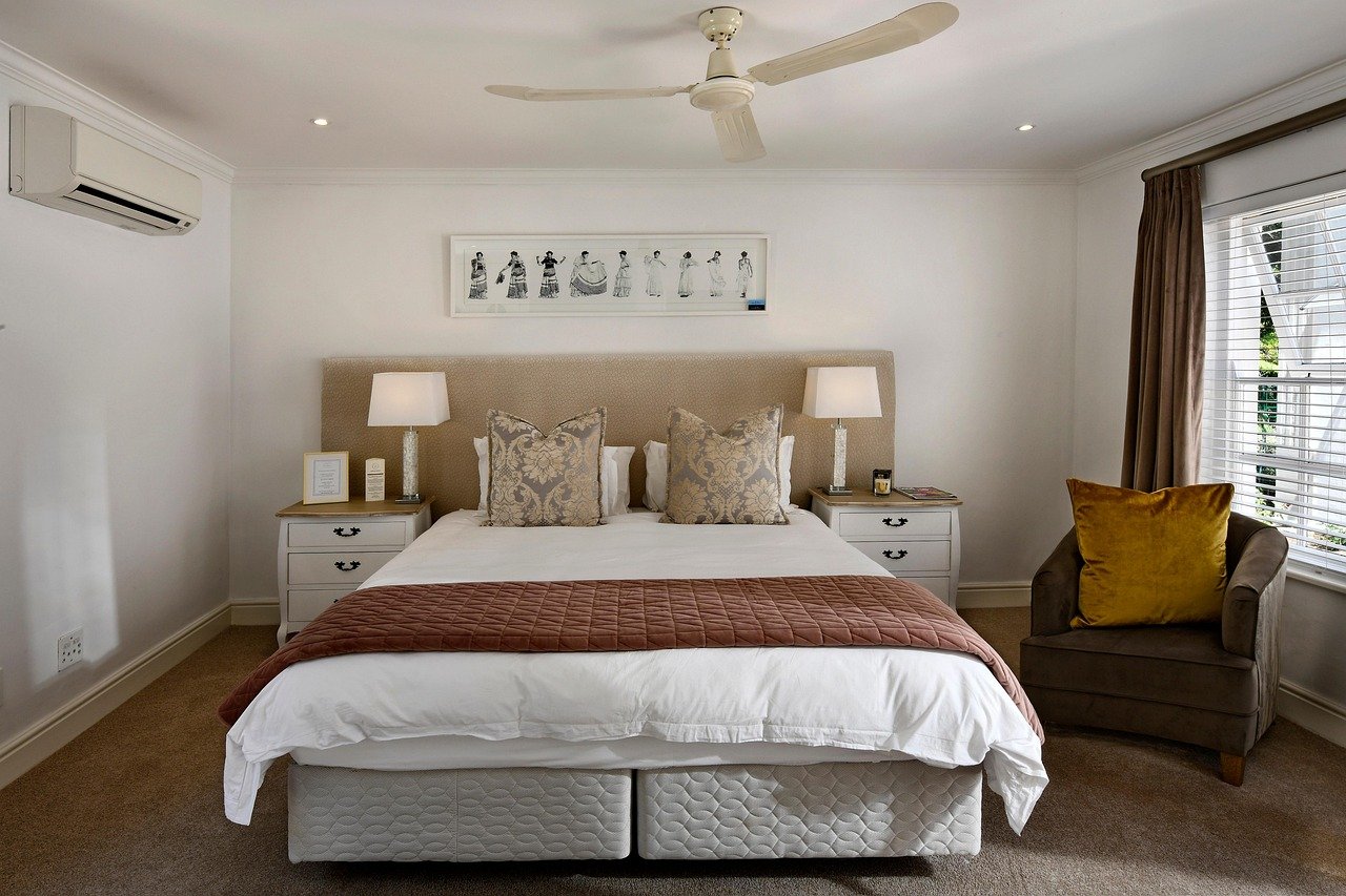 A made-up bed in a modern hotel room