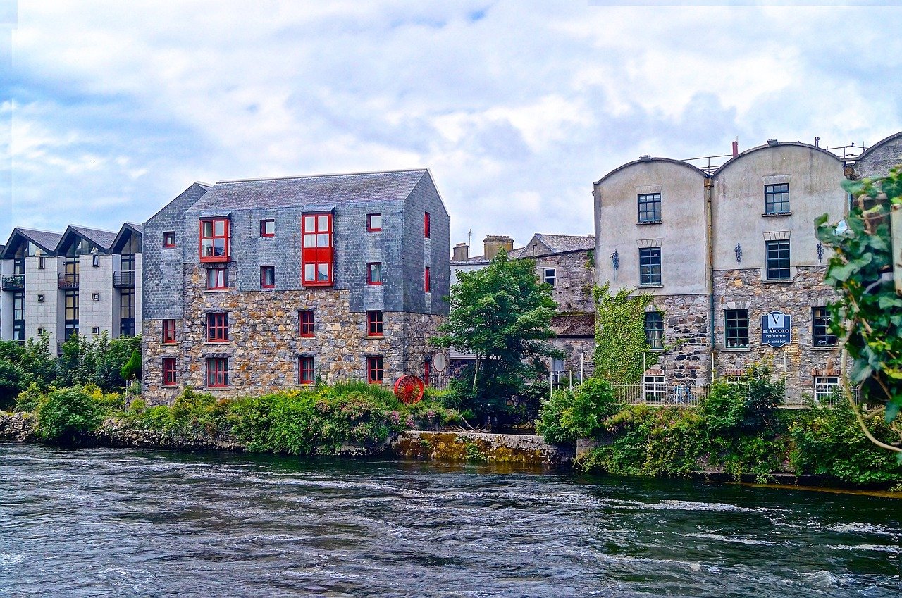 Stone buildings on the River Corrib by Galway's Latin Quarter