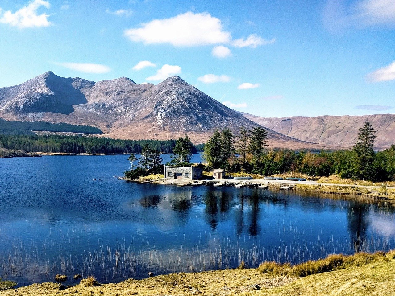 Connemara mountains and a still lough on the road to Clifden
