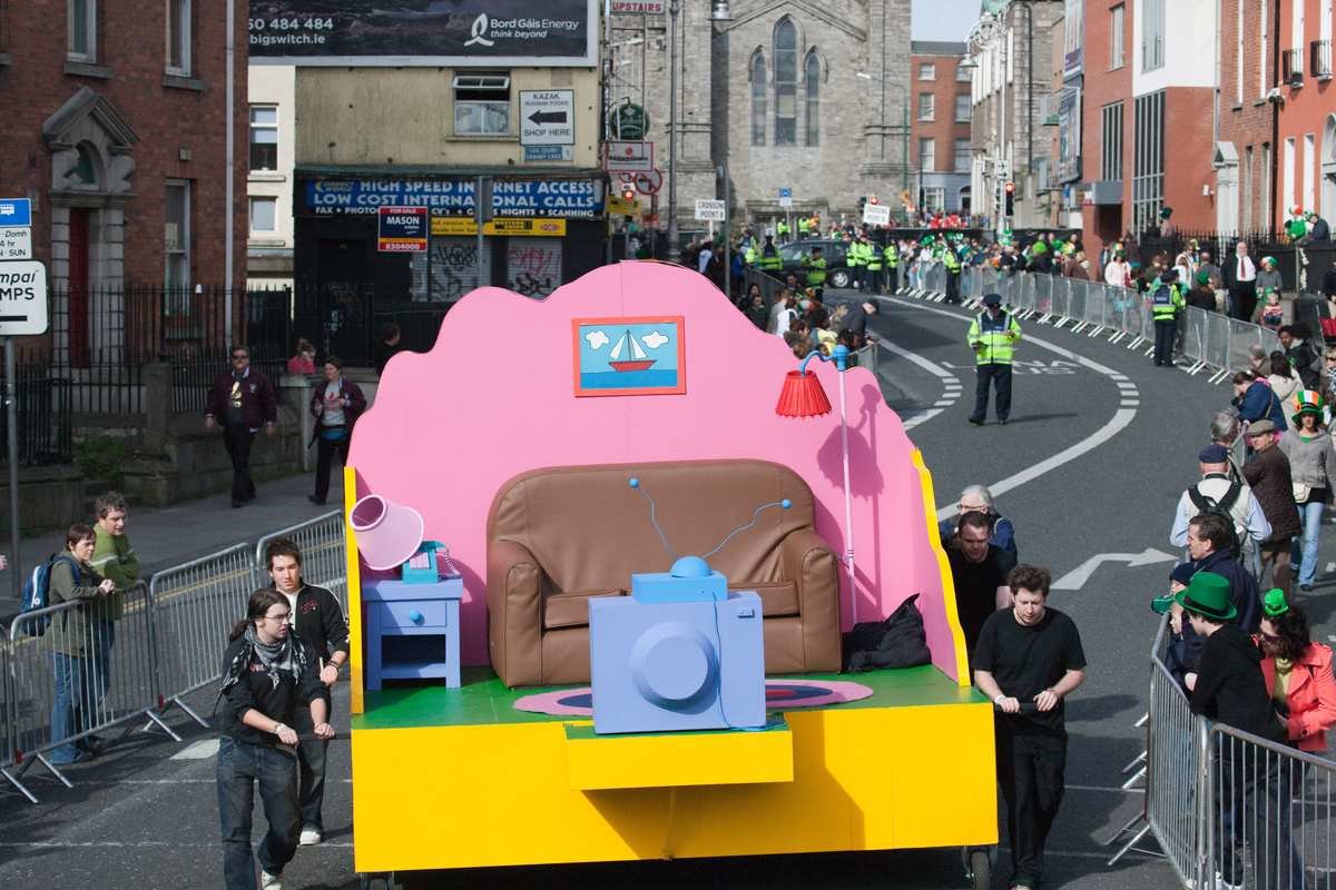 A parade float on St Patrick's Day in Ireland passing crowds on a Dublin street