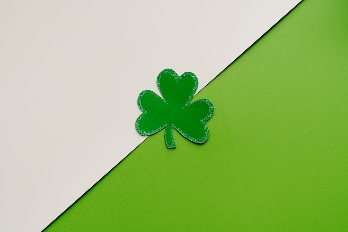 Green shamrock on a green and white background