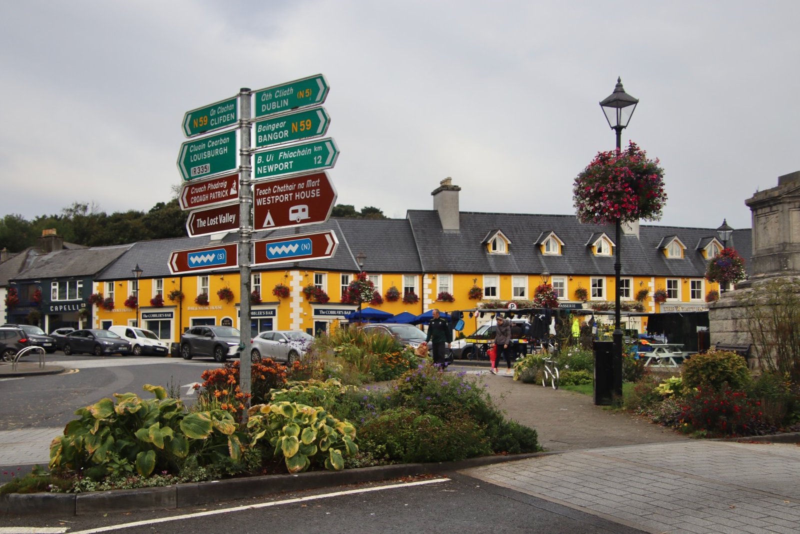 Signpost in Westport pointing to Croagh Patrick, Westport House and Newport