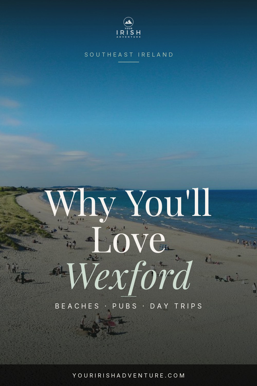 Sandy beach and seaside village in County Wexford on Ireland's southeast coast with blue sky