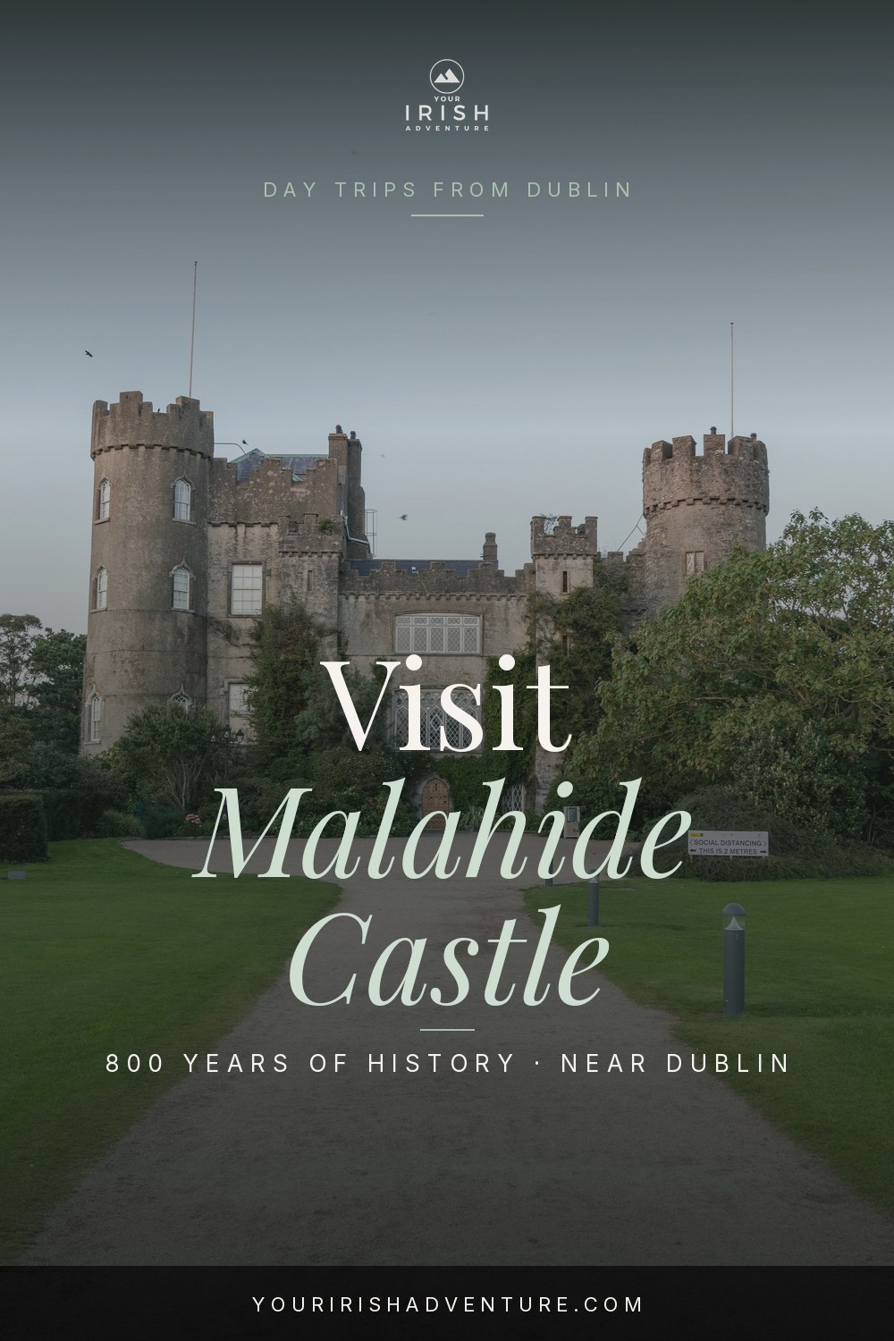 Malahide Castle towers and gardens on a bright day in County Dublin Ireland