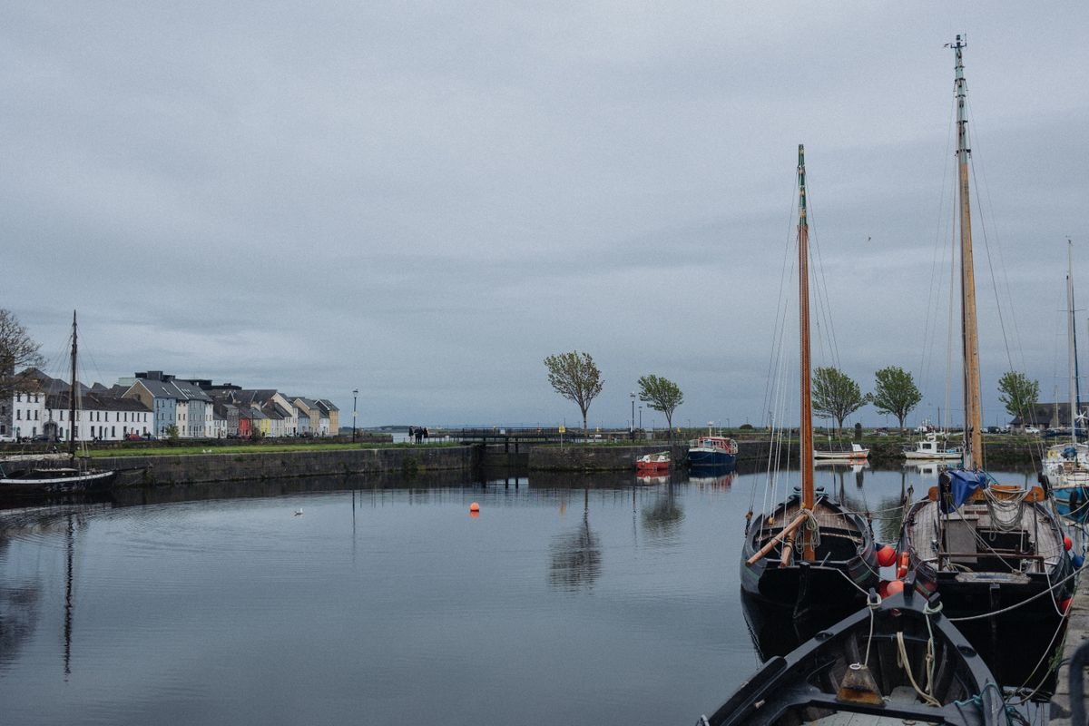 Traditional boats moored at an Irish harbour quay