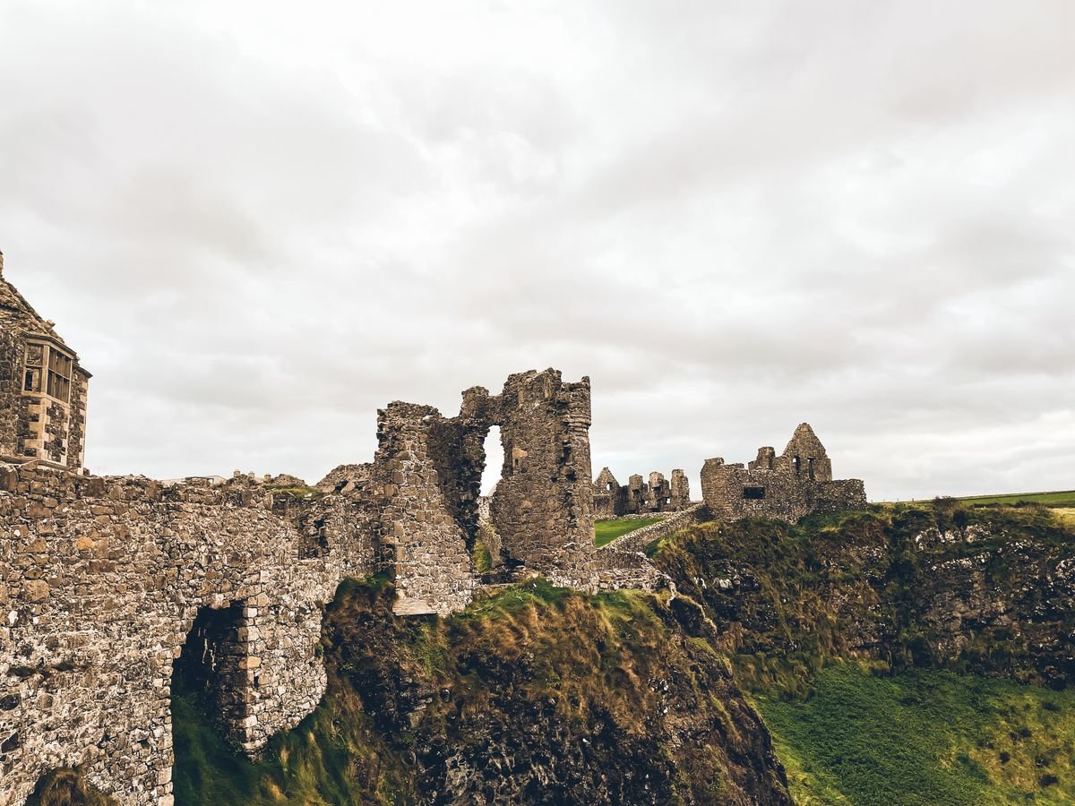 The ruined walls of Dunluce Castle on the clifftop on the Antrim coast