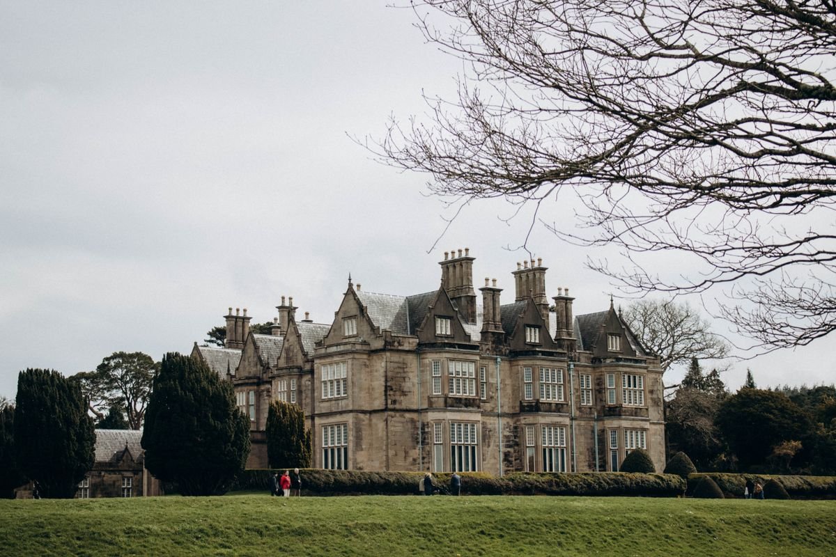 Grey stone country house estate with parkland, near the Cuilcagh boardwalk