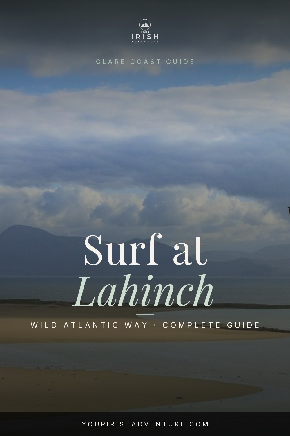Wide low-tide view of Lahinch Beach in County Clare with mountains across the bay