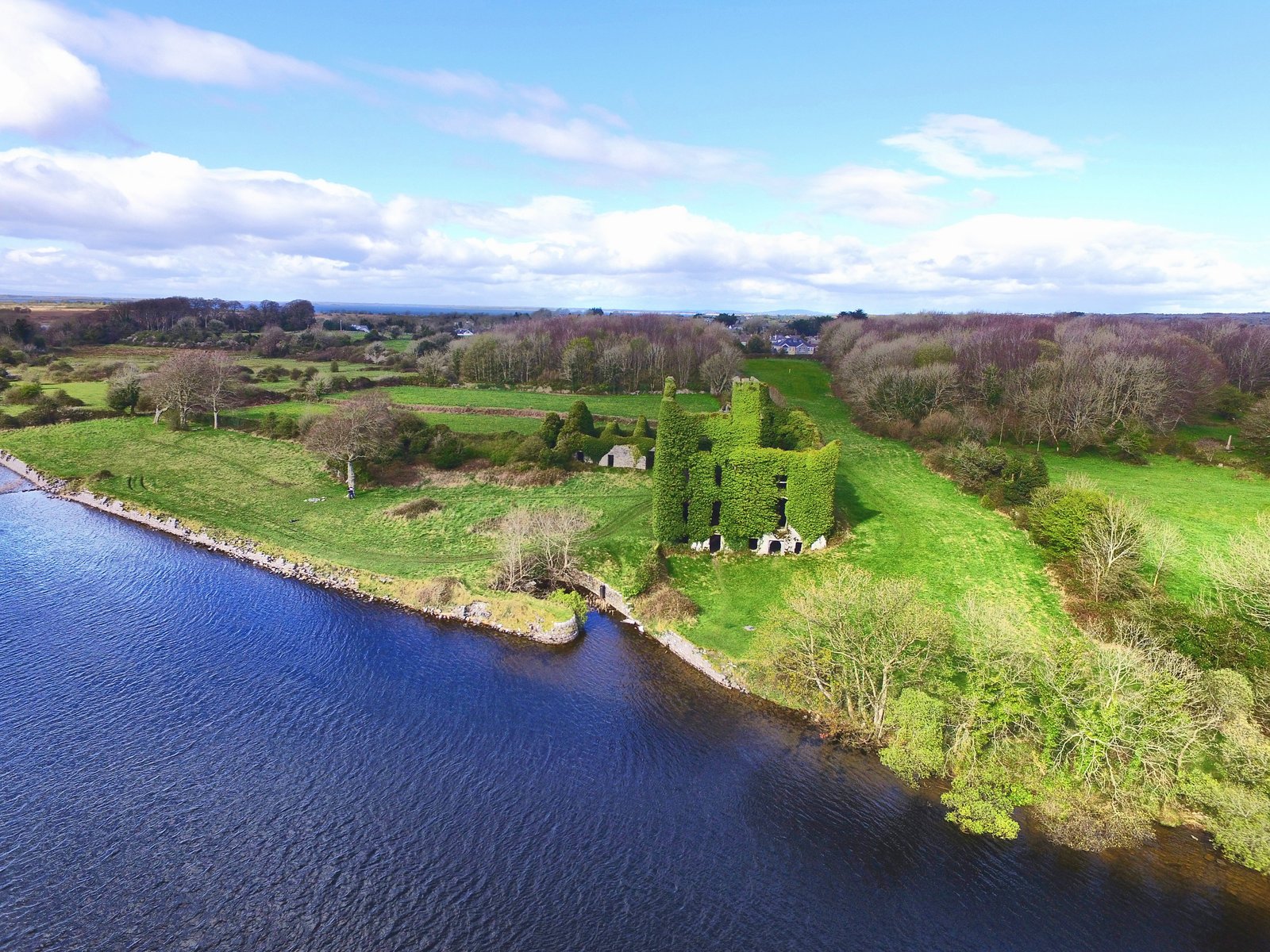 Ivy-covered Menlo Castle ruin on the bank of the River Corrib near Galway