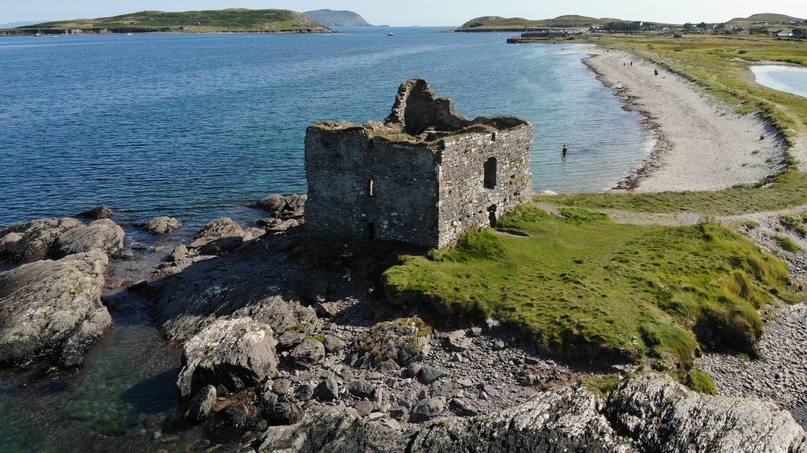 Ballinskellig Castle tower-house ruin on the shore of Ballinskelligs Bay in County Kerry