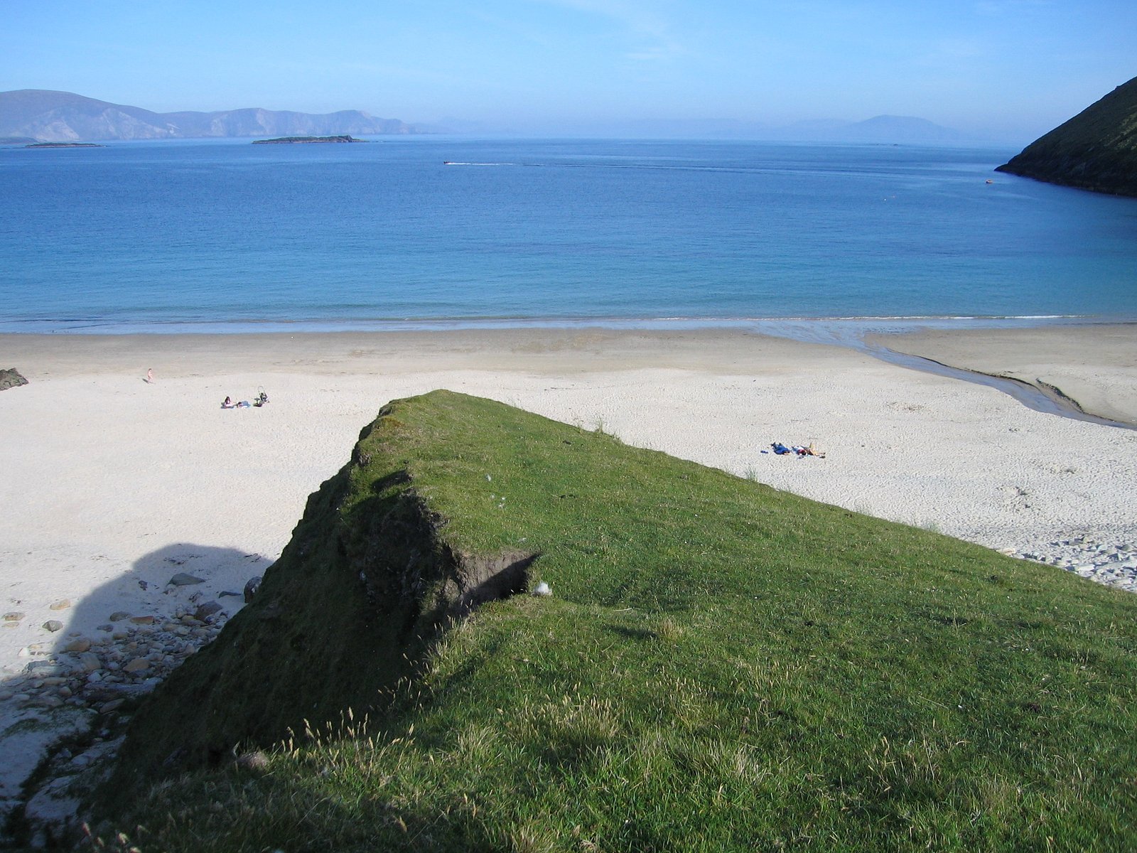 The blue horseshoe bay and white sand of Keem Beach on Achill Island.