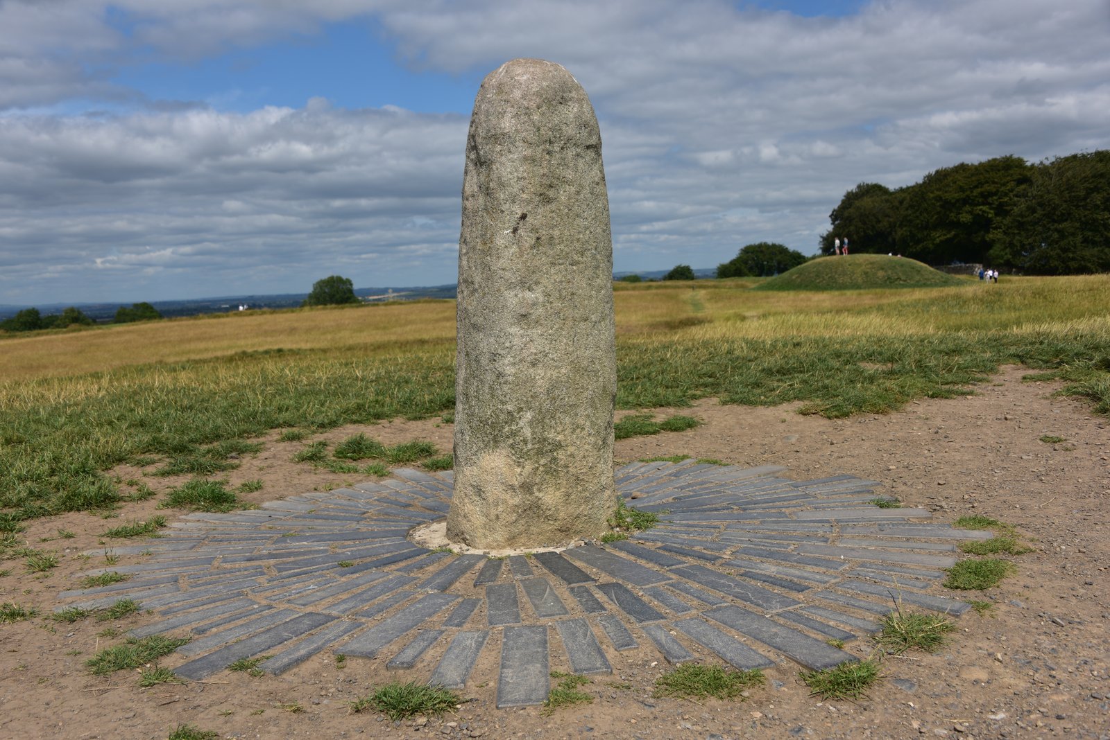 The Lia Fail standing stone on the grassy hilltop at the Hill of Tara