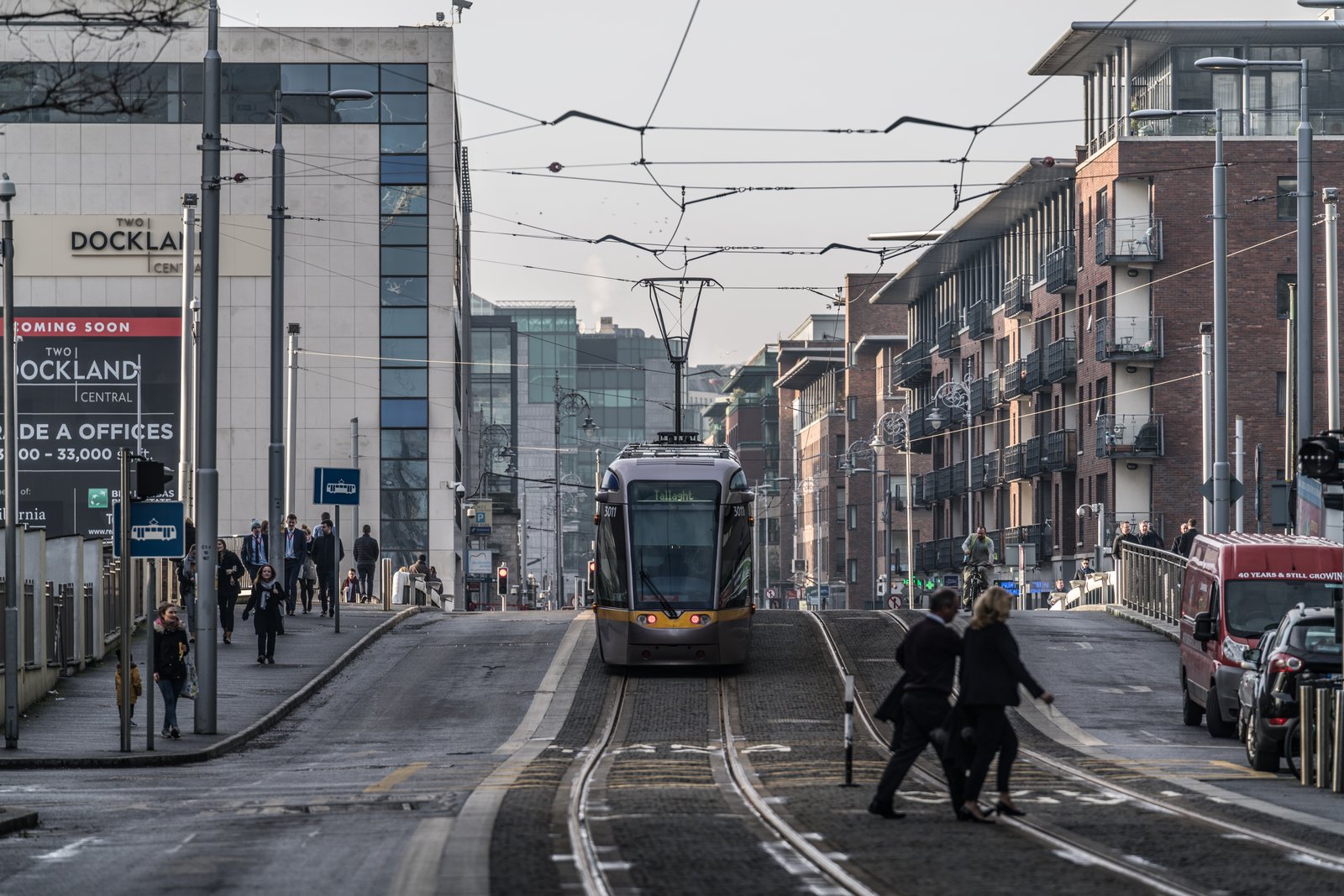 A Luas tram running along street tracks in Dublin