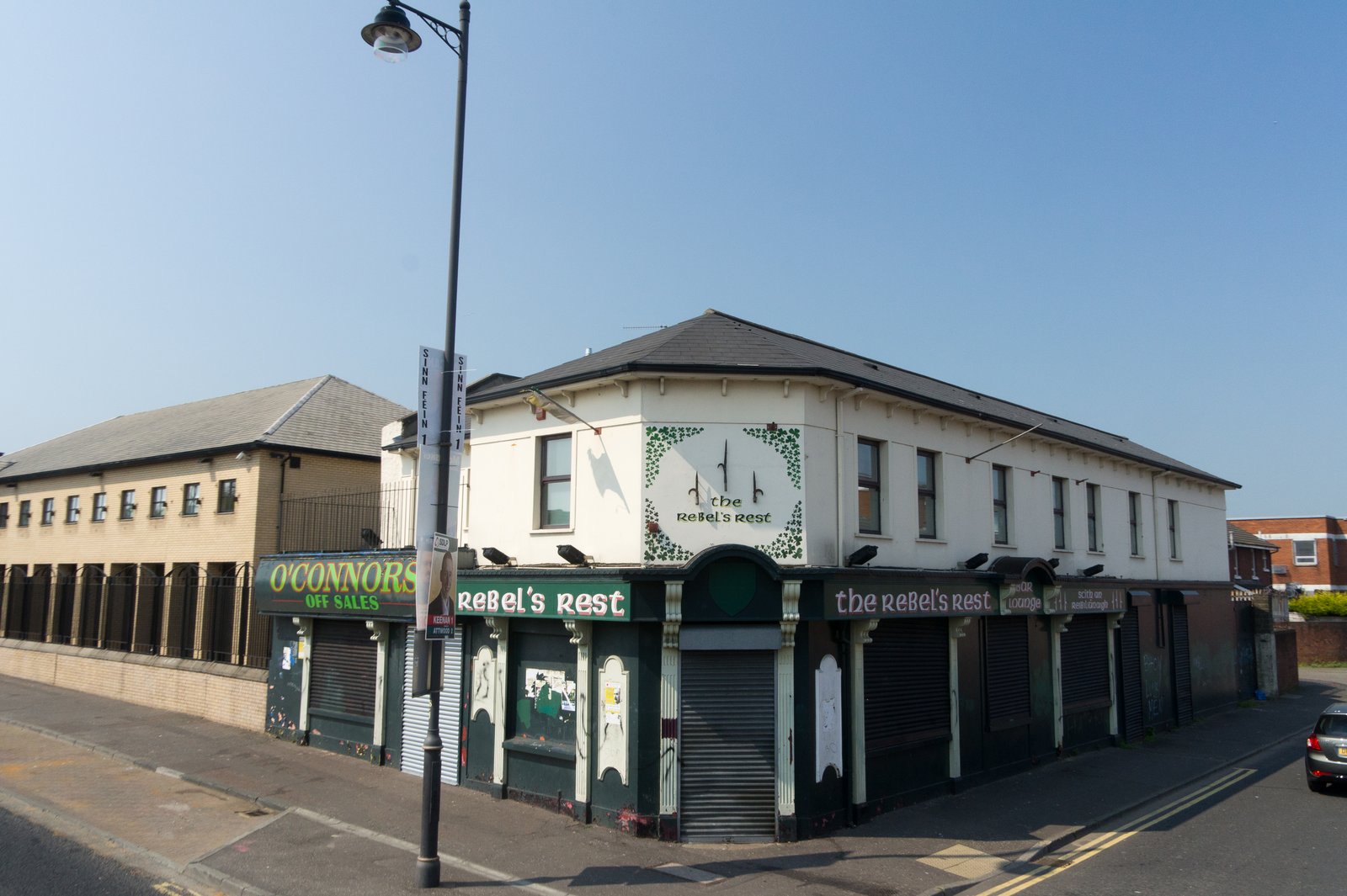 Street corner on the Falls Road with old republican shopfronts