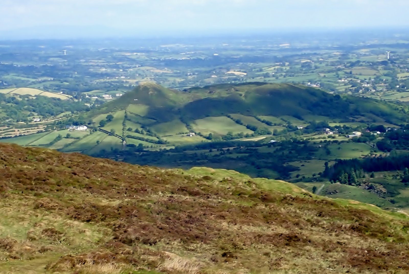 Green hills and countryside of the Ring of Gullion seen from the slopes of Slieve Gullion
