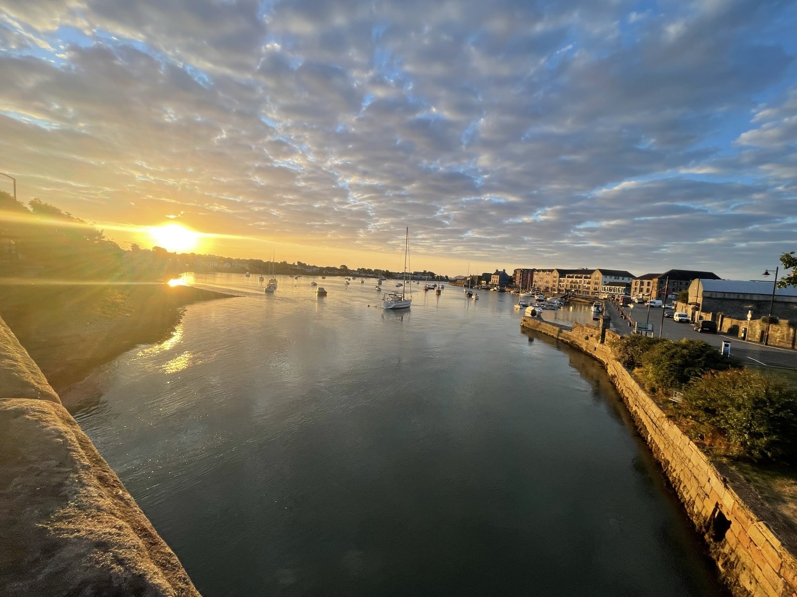 Dungarvan harbour at sunset with moored boats