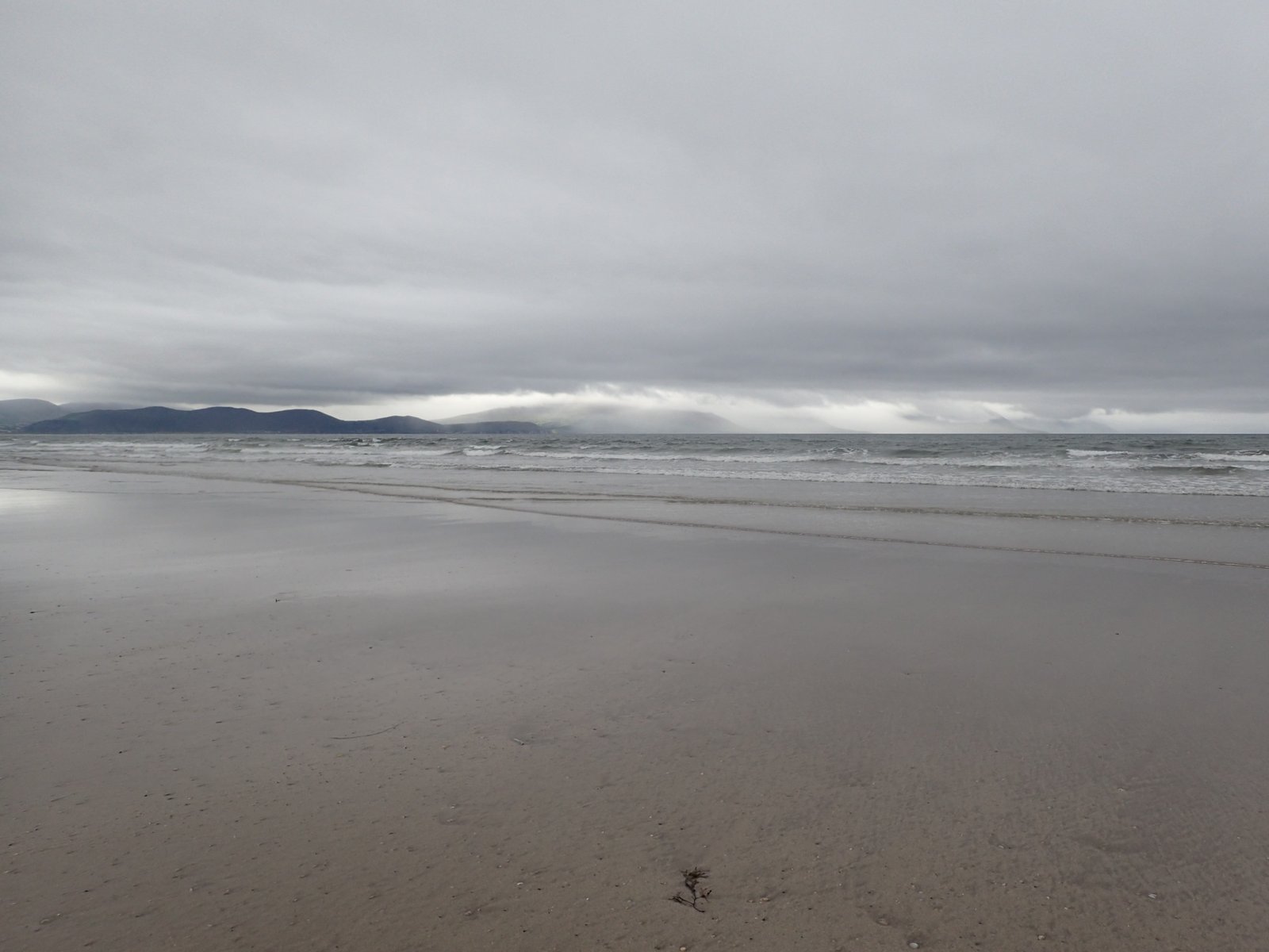 Waves and rocky shore at Inch Beach on the Dingle Peninsula
